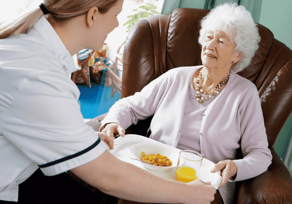 lady in care home having food