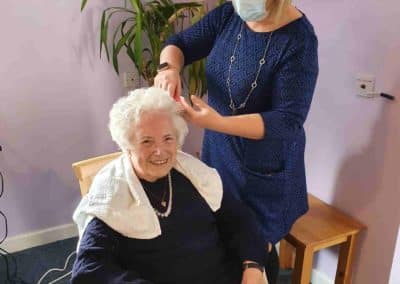 care home resident with hair styled