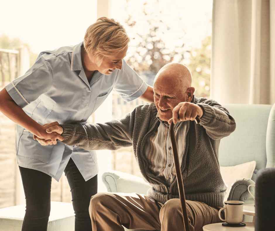 Elderly Man Being Helped by Nurse