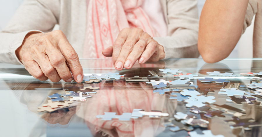 elderly person doing a jigsaw