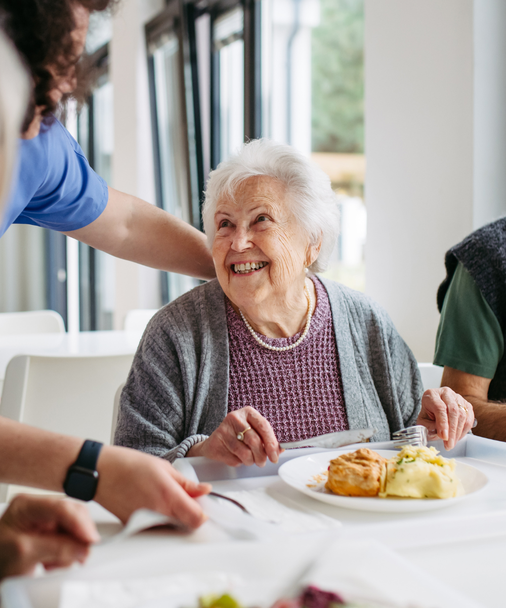 Portrait of senior man eating a healthy salad for lunch